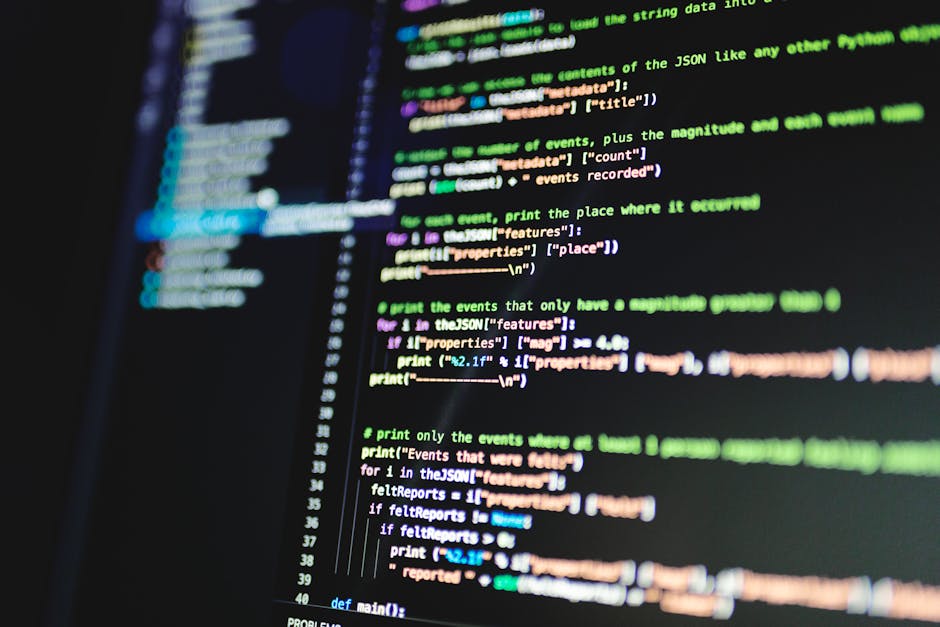 Close-up of colorful programming code displayed on a monitor.